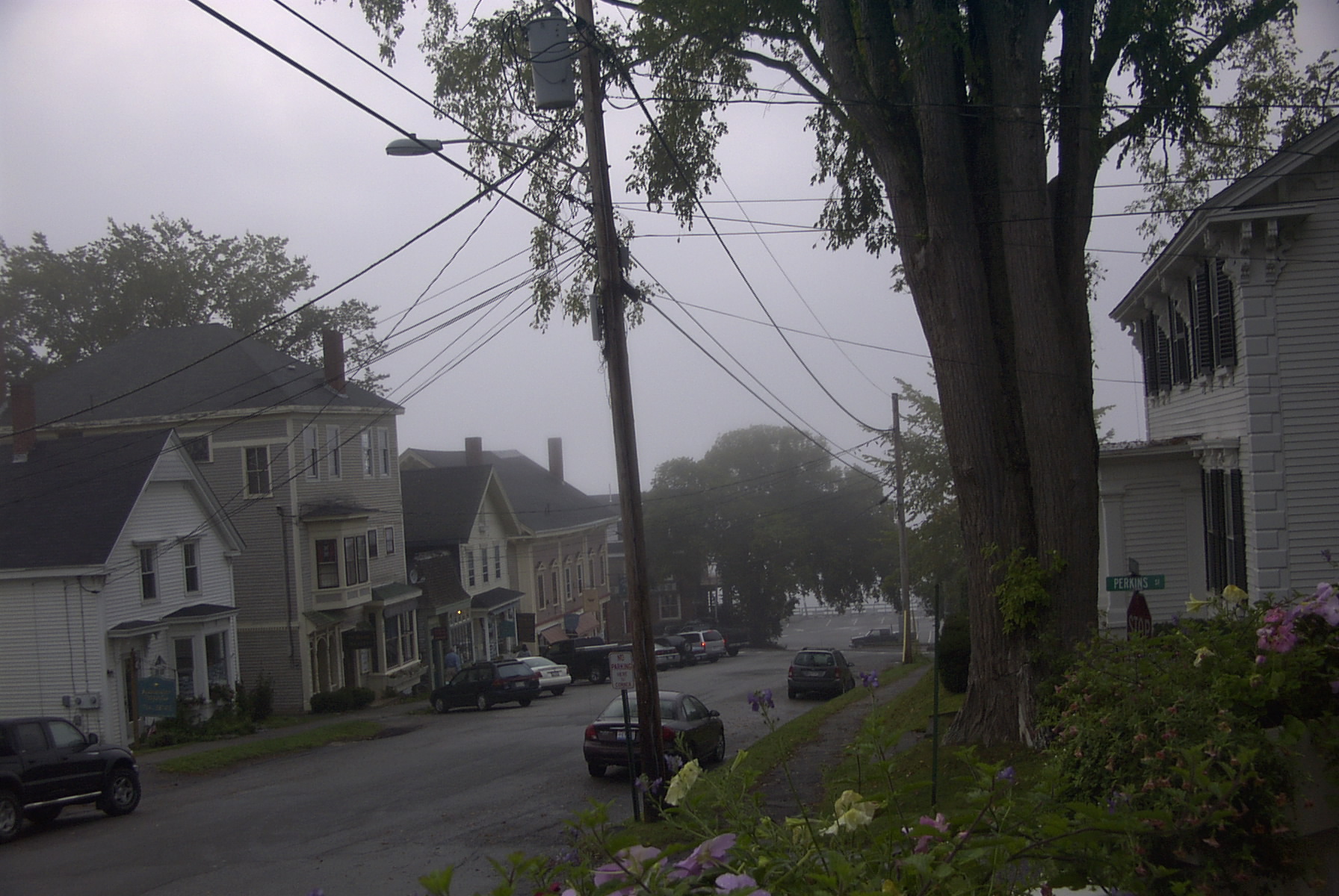 A view of Main Street in Castine, Maine with historic buildings.