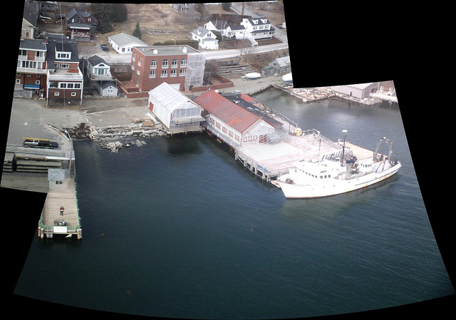 An aerial view of Castine Maine's waterfront with boats in the harbor.
