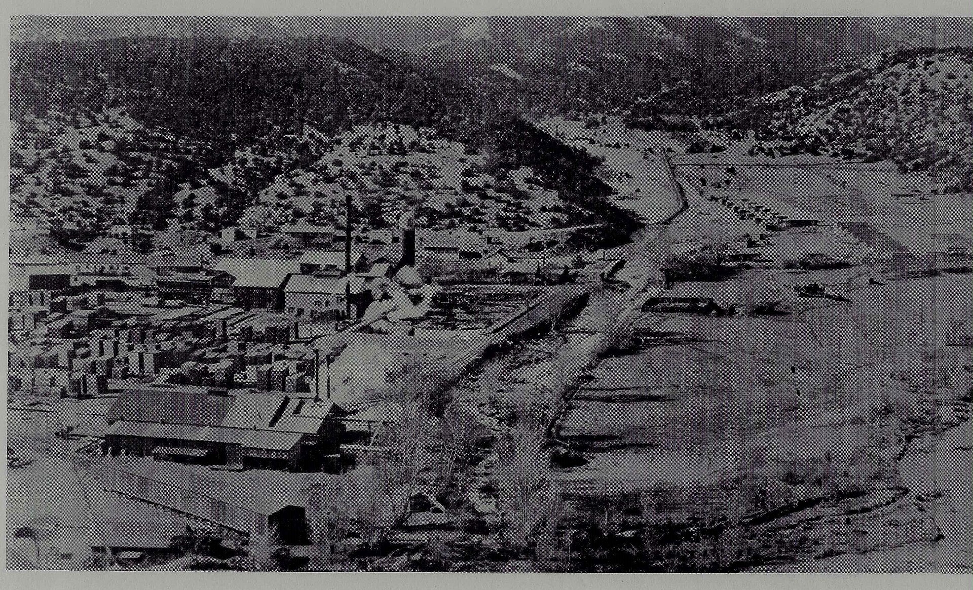 Historic lumber mill buildings with a view over La Madera, New Mexico