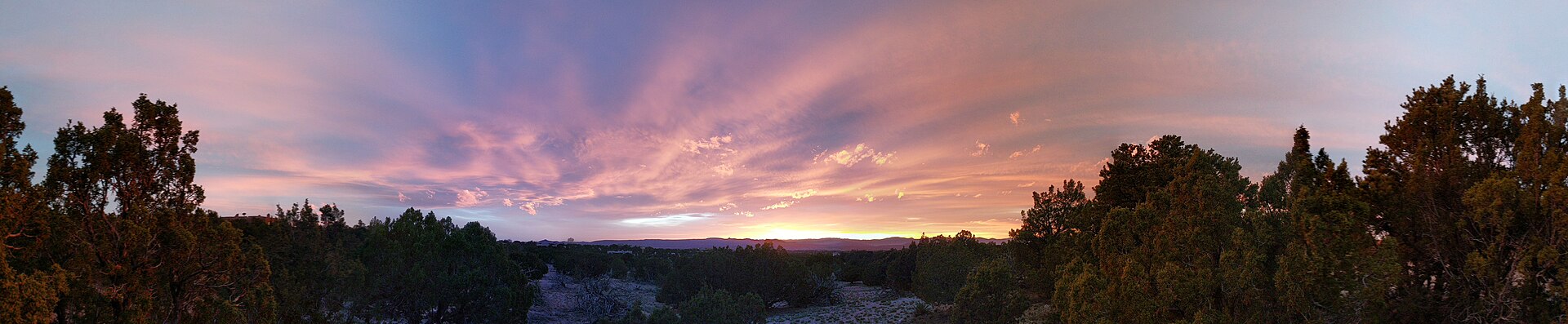 The sun setting over the desert, as seen from a hill outside of Santa Fe, New Mexico.
