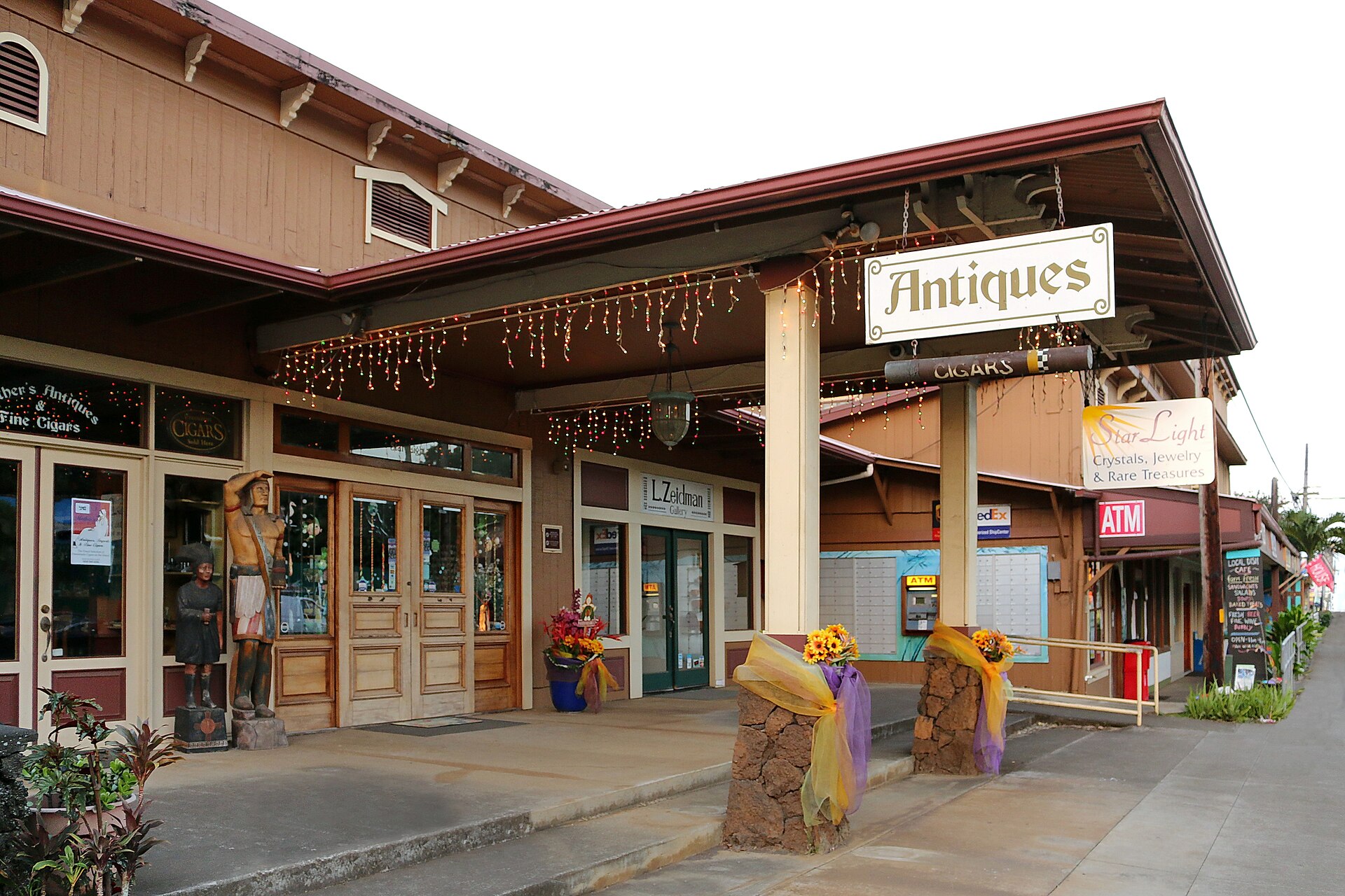 A storefront in Hawi, Hawaii, with an 'Antiques' sign in the window