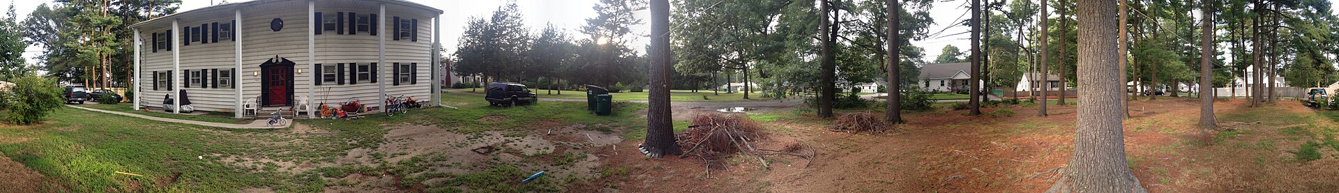 A residential house and yard at 422 Reservoir Street in Norton, Massachusetts