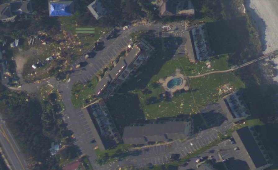 Aerial view of scattered debris and damaged roofs in Crescent Beach after Hurricane Irma