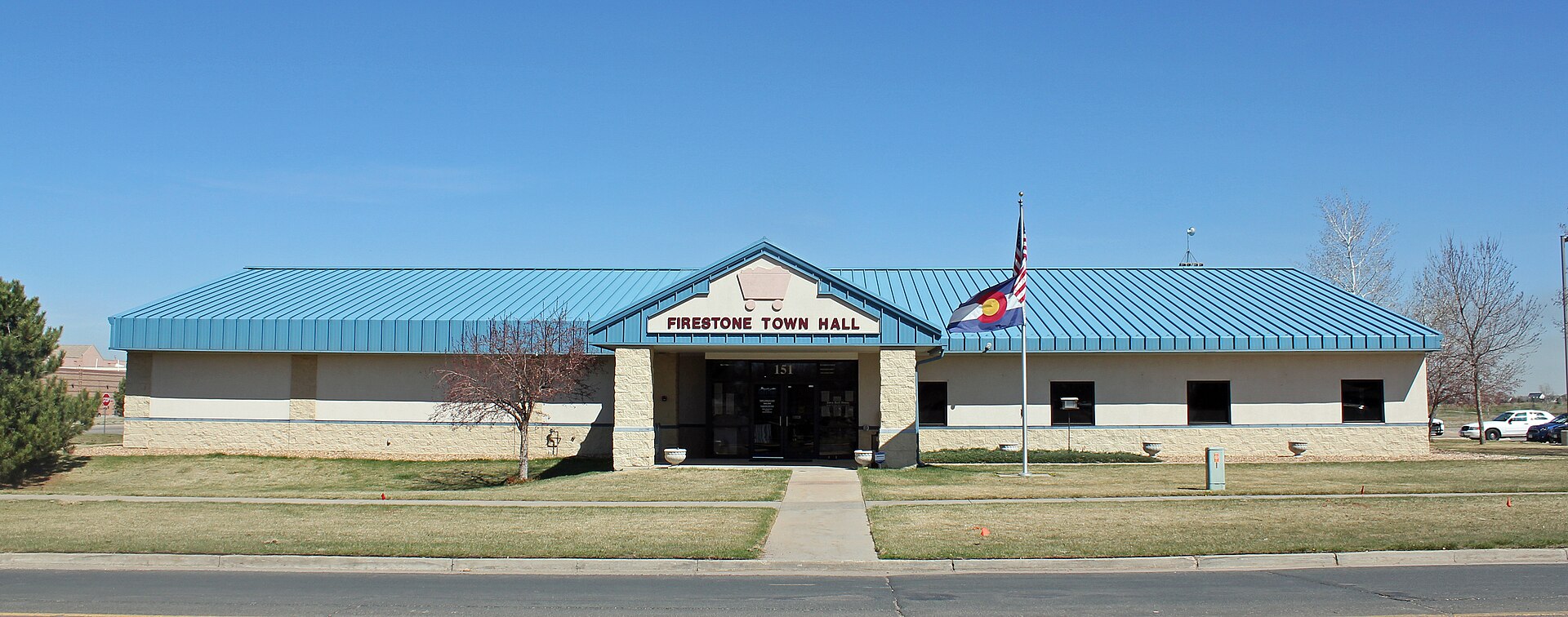 The former town hall building of Firestone, Colorado, a small brick civic building.