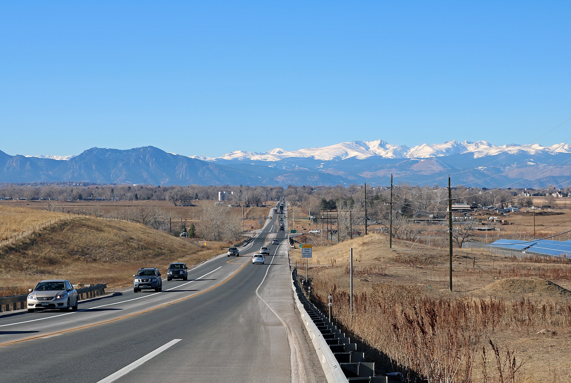 Baseline Road stretching toward snow-capped Front Range peaks near Lafayette, Colorado
