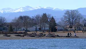 Windsor Lake in Windsor, Colorado, with mountains visible in the distance.