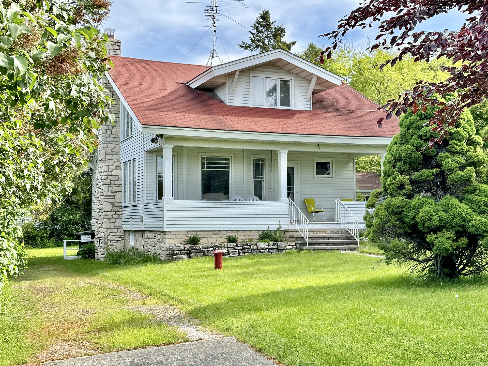 A small Arts and Crafts-style cottage on Cherry Street in Ephraim, Wisconsin.