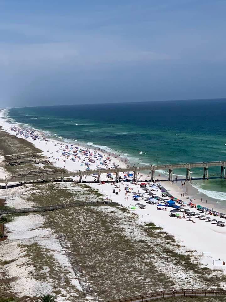 Navarre Beach, Florida, with the water tower and beachgoers