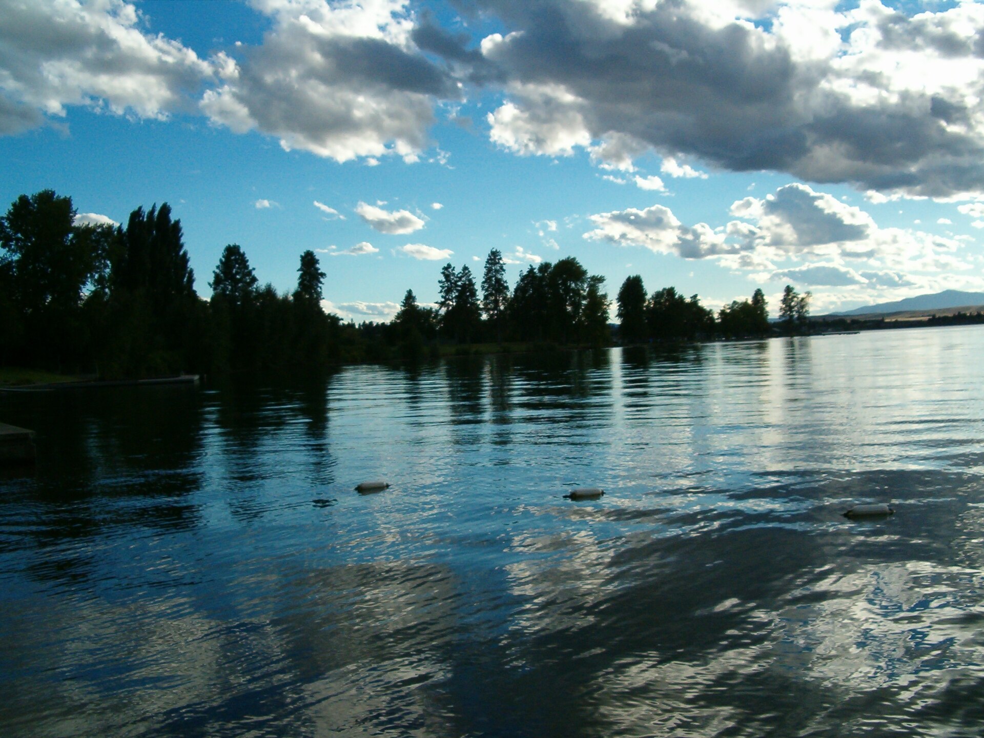 Dramatic clouds above the blue water of Flathead Lake near Polson, Montana.
