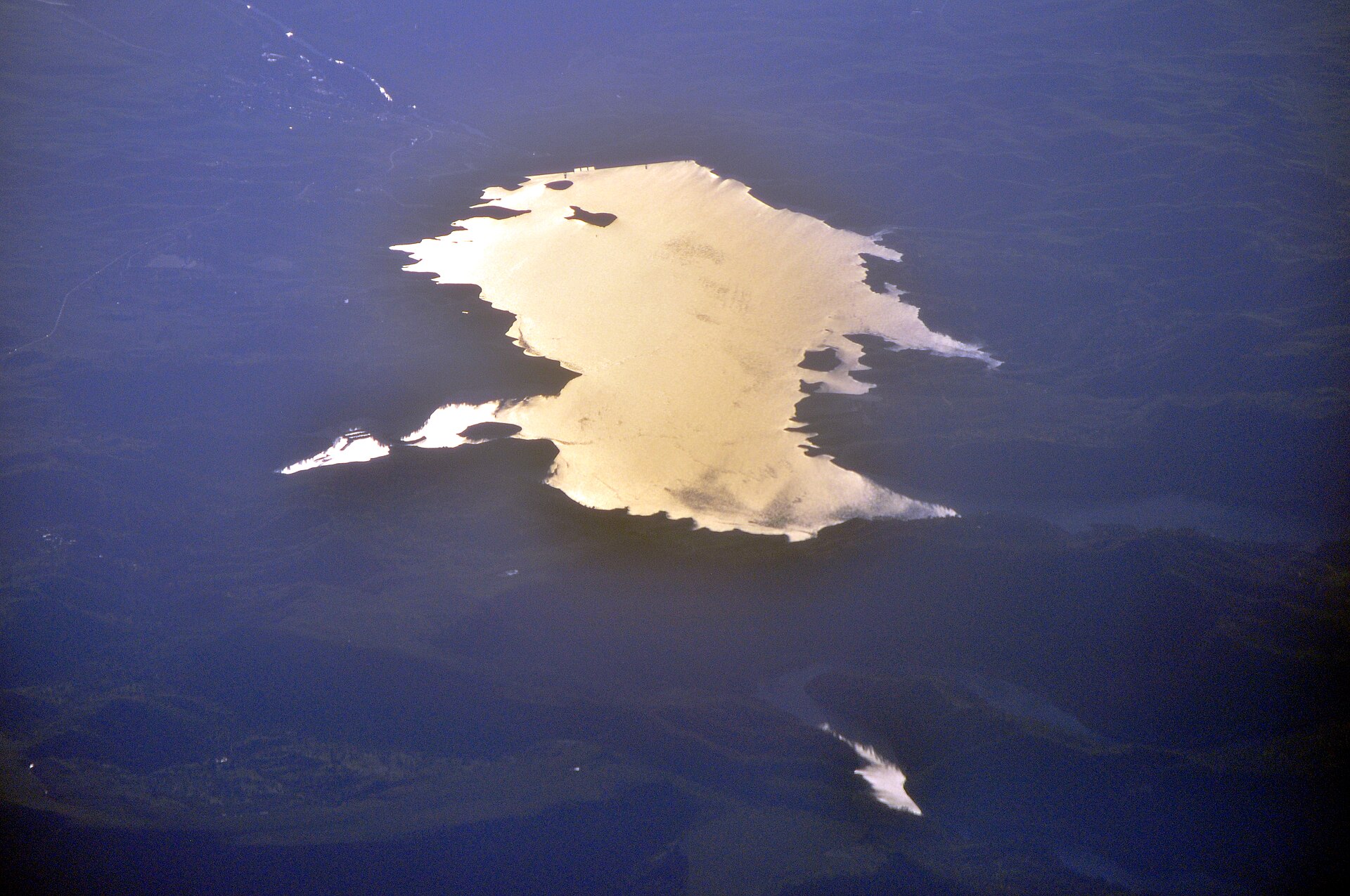 Aerial view of Millerton Lake glowing gold at sunset, Fresno County, California