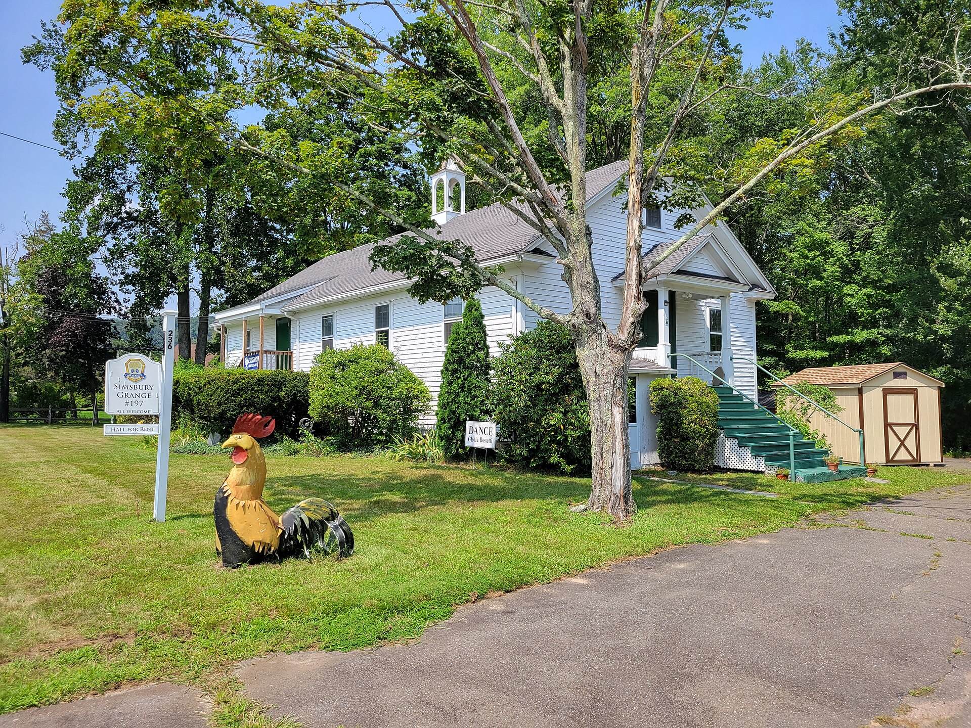 Simsbury Grange #197 hall with a rooster sculpture on the lawn