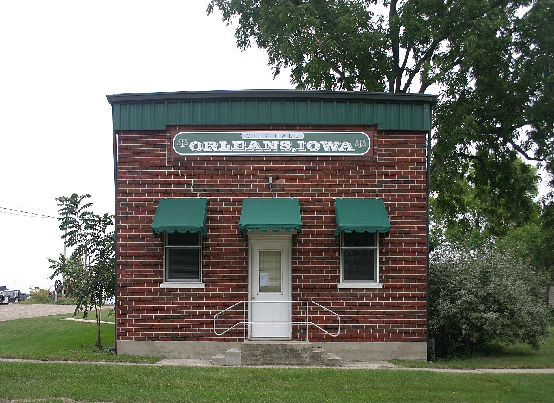 The brick city hall building in Orleans, Iowa.