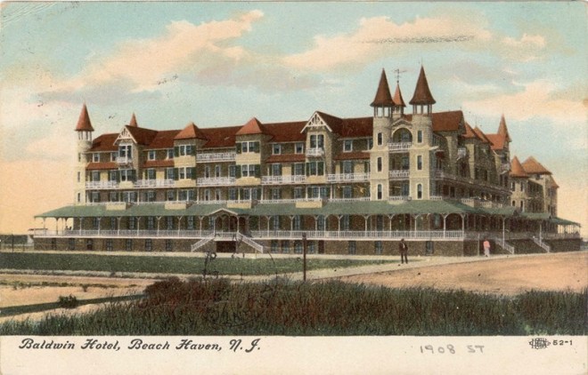 A hand-tinted 1908 postcard of a grand Victorian beachfront hotel with wraparound porches and pointed towers.