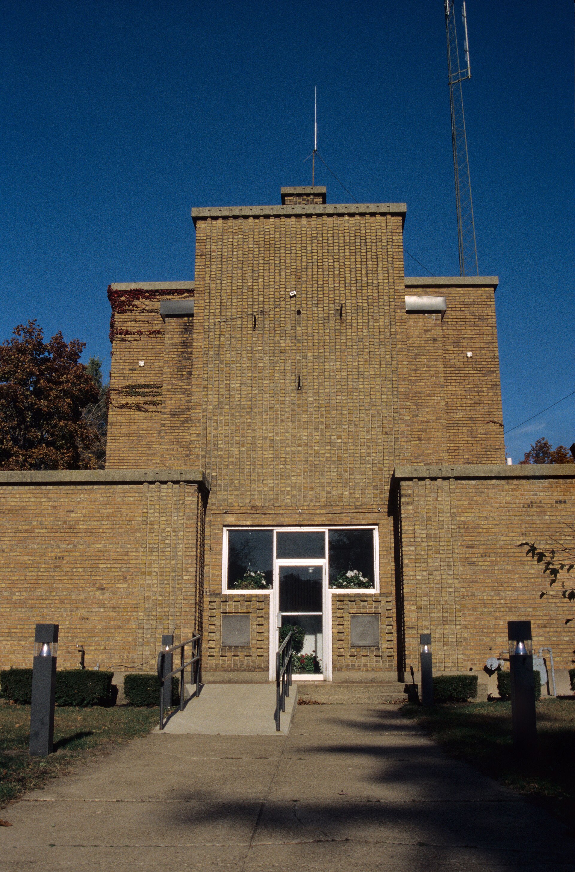 The Long Beach Town Center building in Long Beach, Indiana, surrounded by trees.