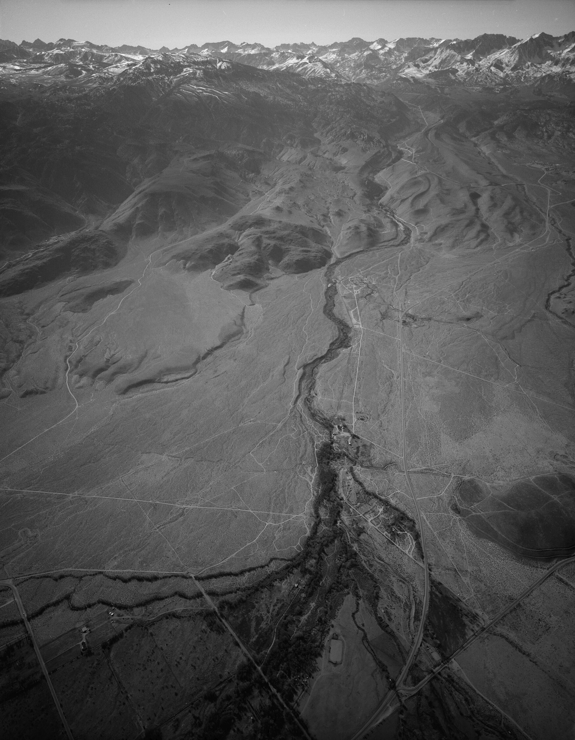 1994 aerial view of Bishop Creek winding toward the Sierra Nevada