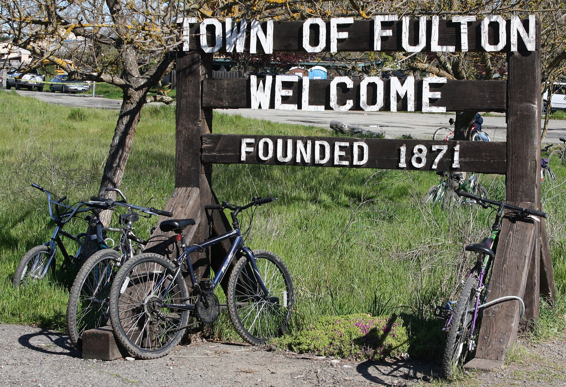 The wooden 'Town of Fulton, Welcome, Founded 1871' sign in Fulton, California.