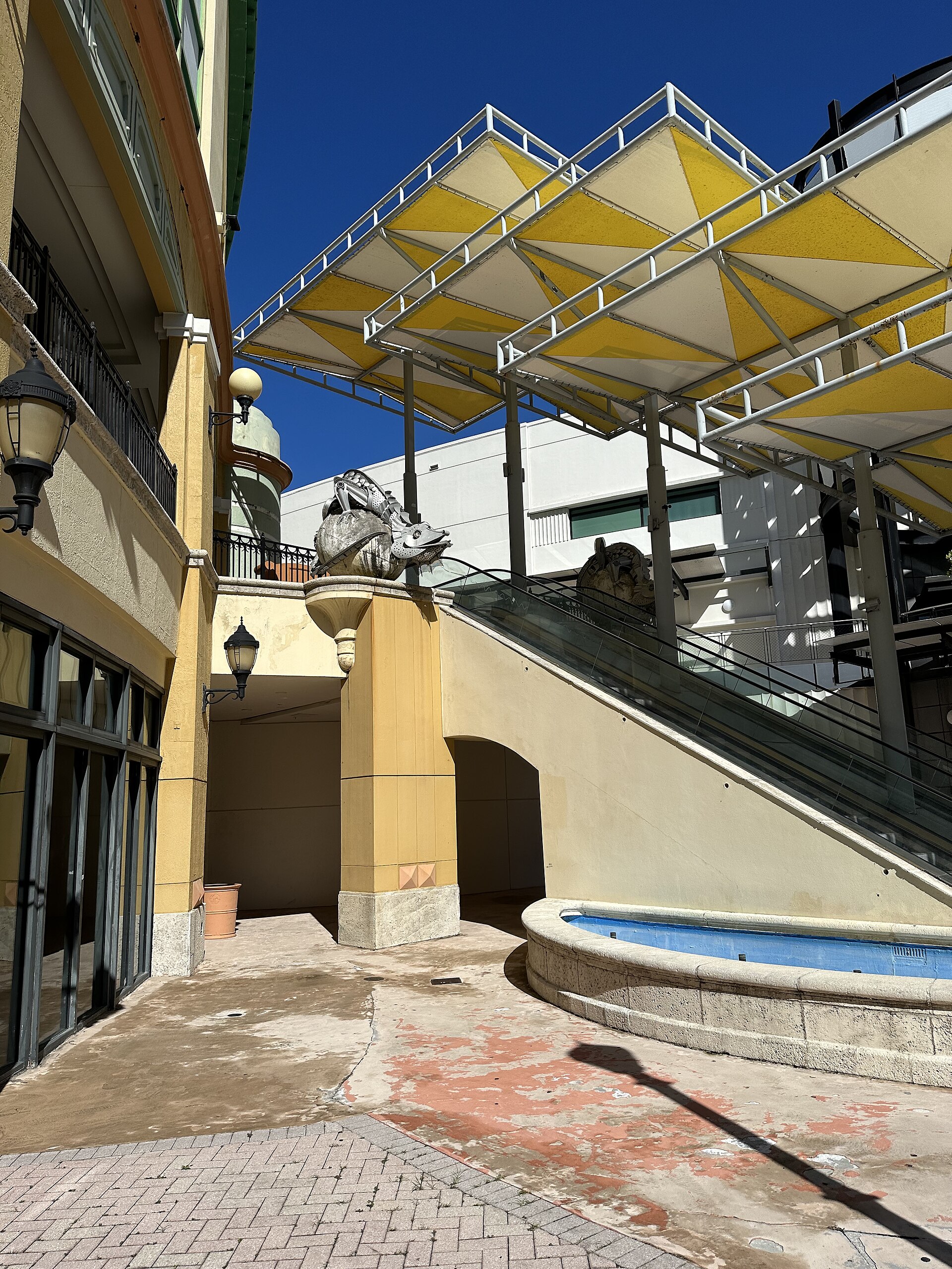 Canopy, escalator, and fountain at the Shops at Sunset Place in South Miami