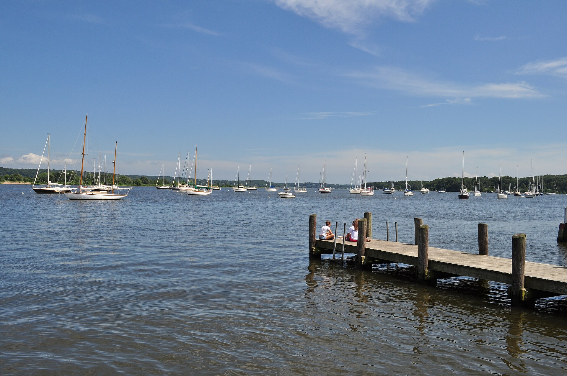 Sailboats moored in Essex harbor, Connecticut, seen from a dock