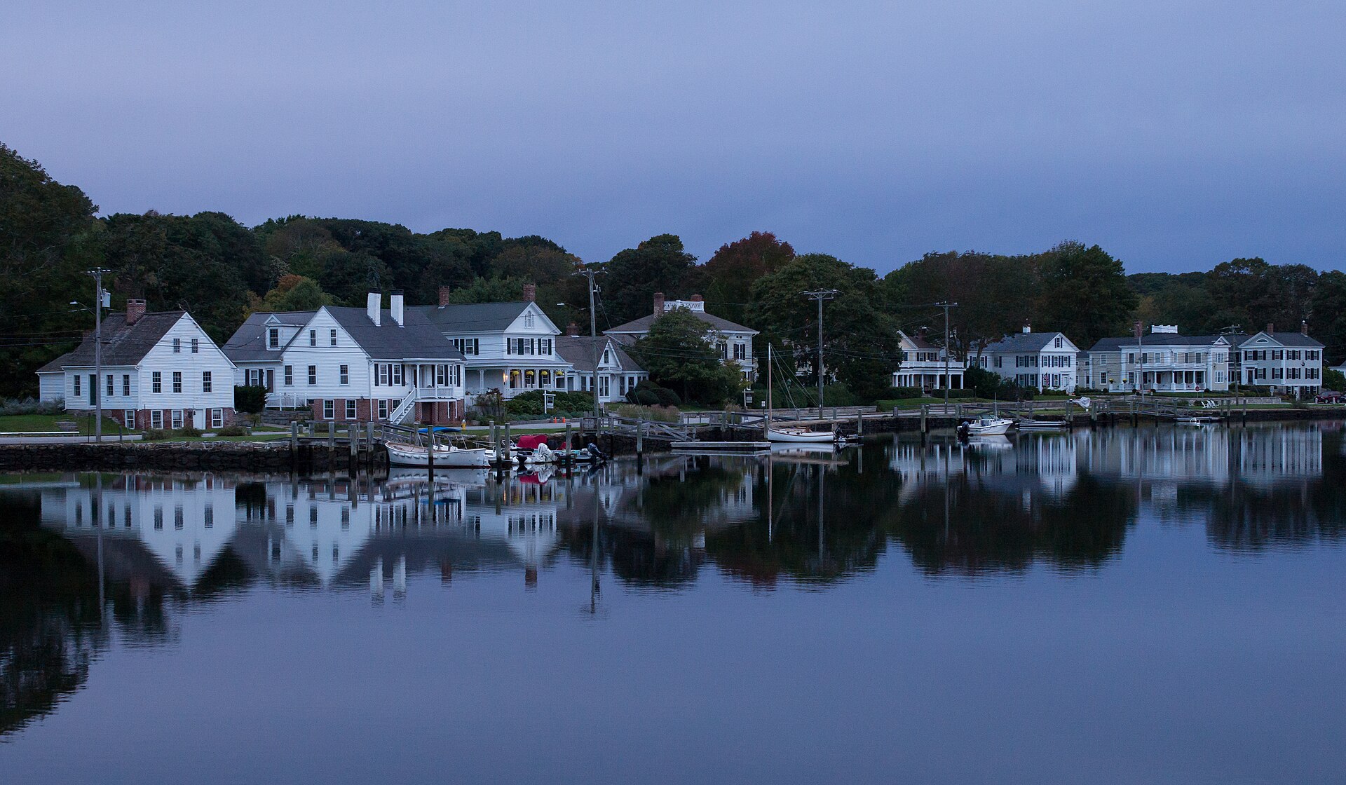 The Mystic, Connecticut waterfront at dawn with boats in the harbor