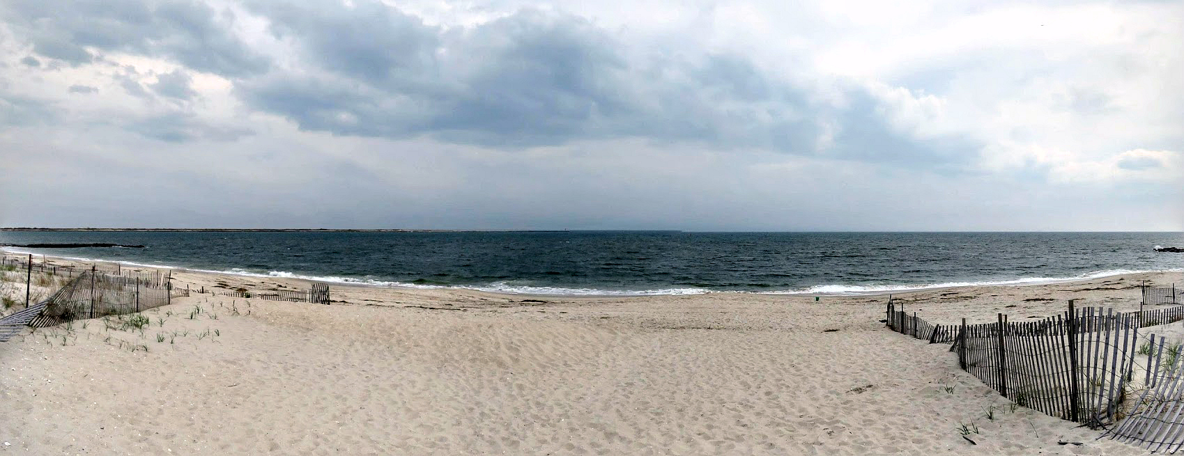 Beachgoers on the sand at Point Lookout Beach