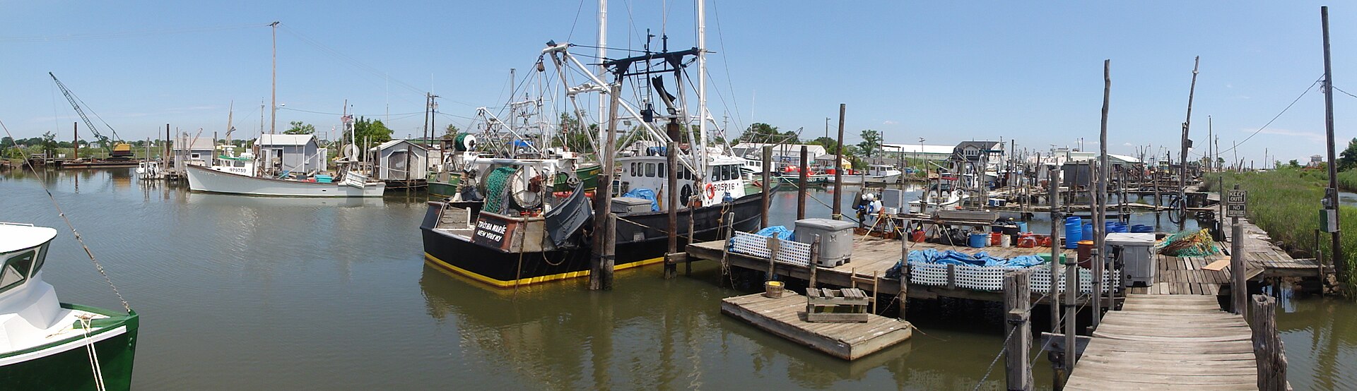 Commercial fishing boats docked at the marina in Belford Harbour, New Jersey.