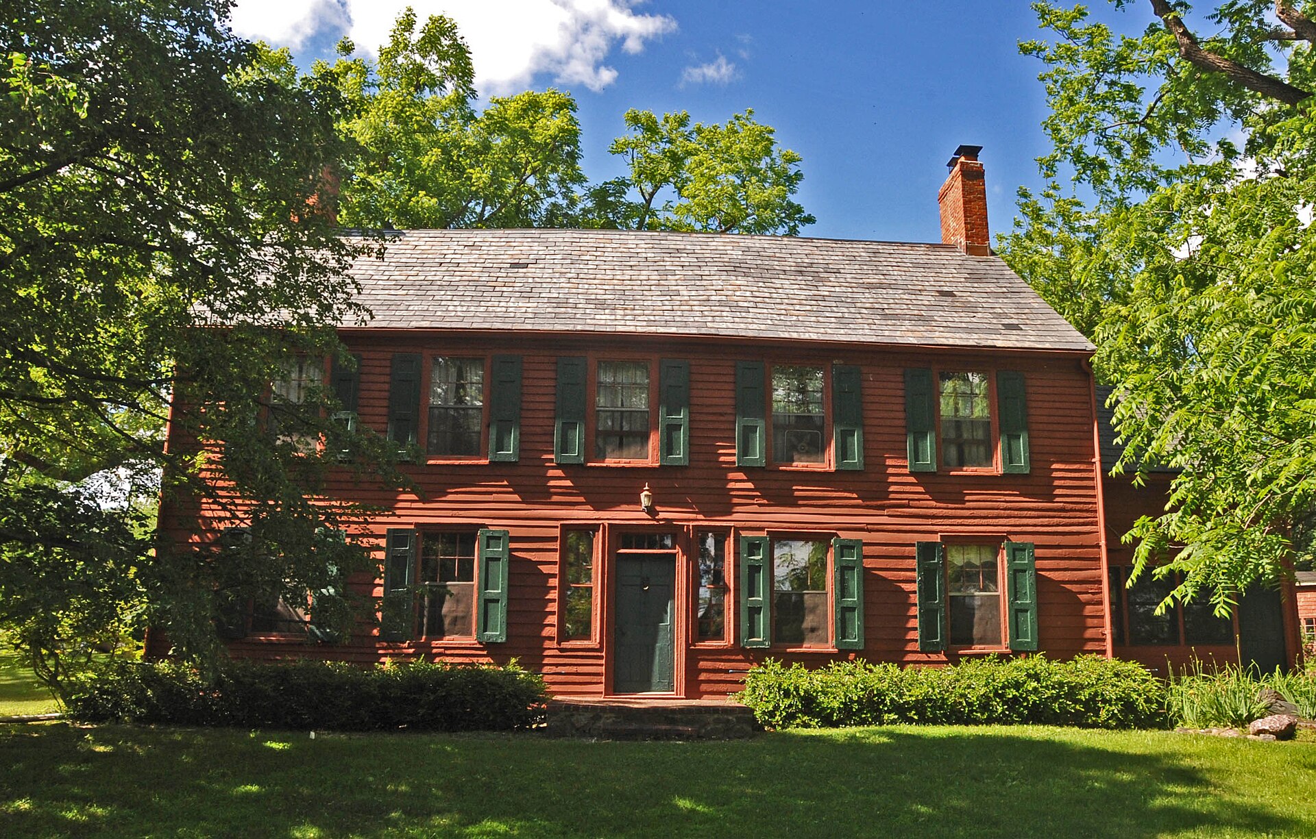 The red Benjamin Howell Homestead, a colonial-era house in Parsippany, New Jersey