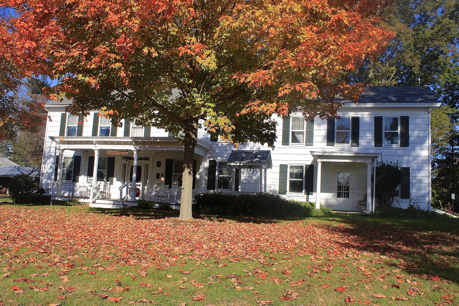 The Oakley Farmstead surrounded by fall foliage in West Freehold, New Jersey.