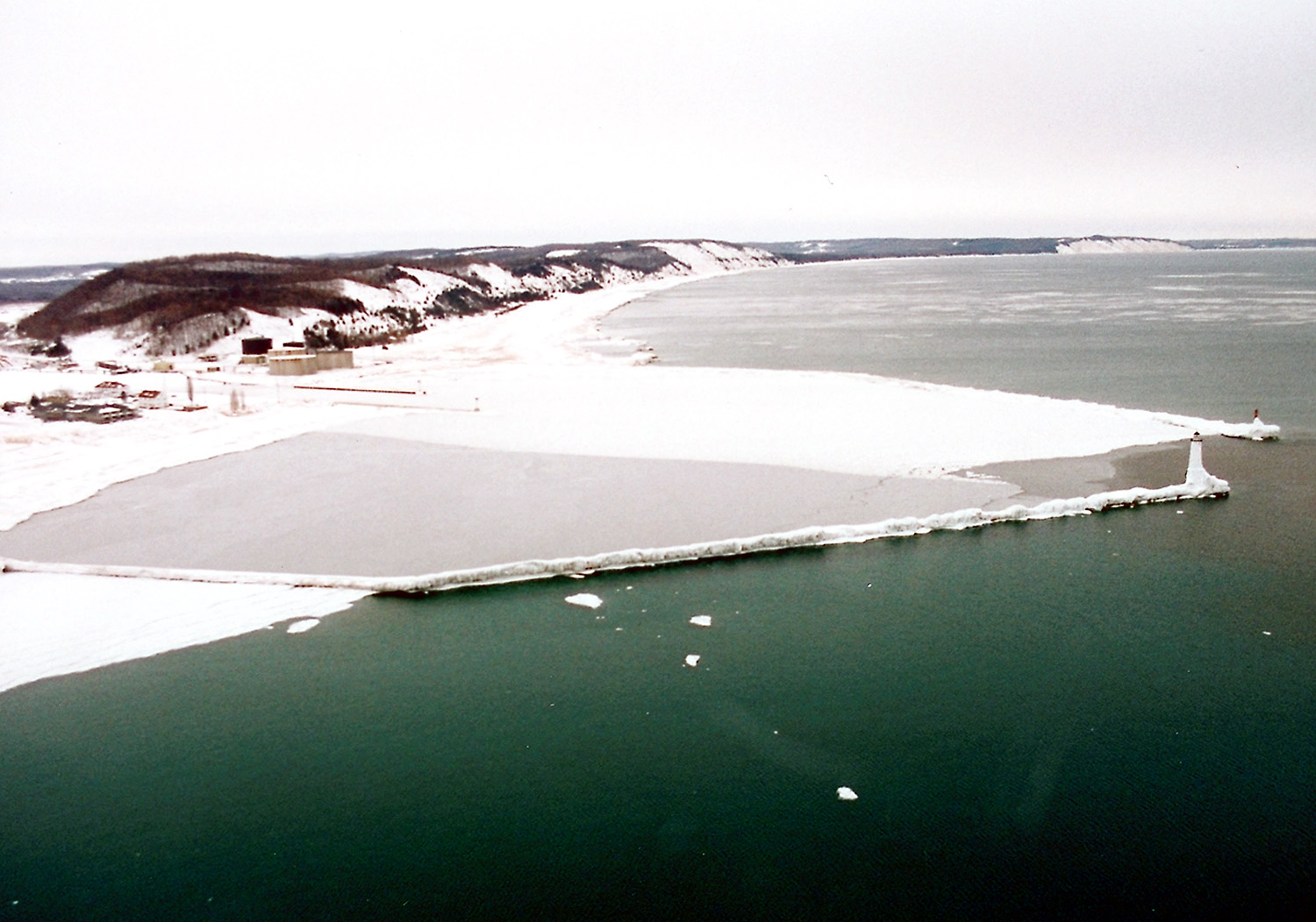 The ice-covered entrance to the harbor and Betsie Lake at Frankfort, Michigan.