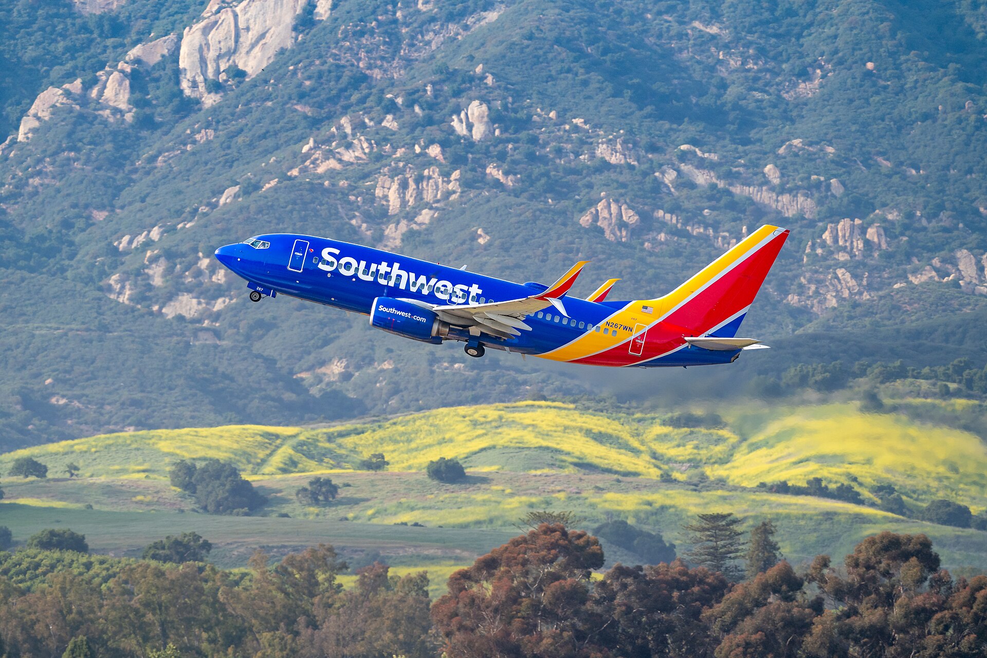 Southwest jet climbing out over the hills of Goleta
