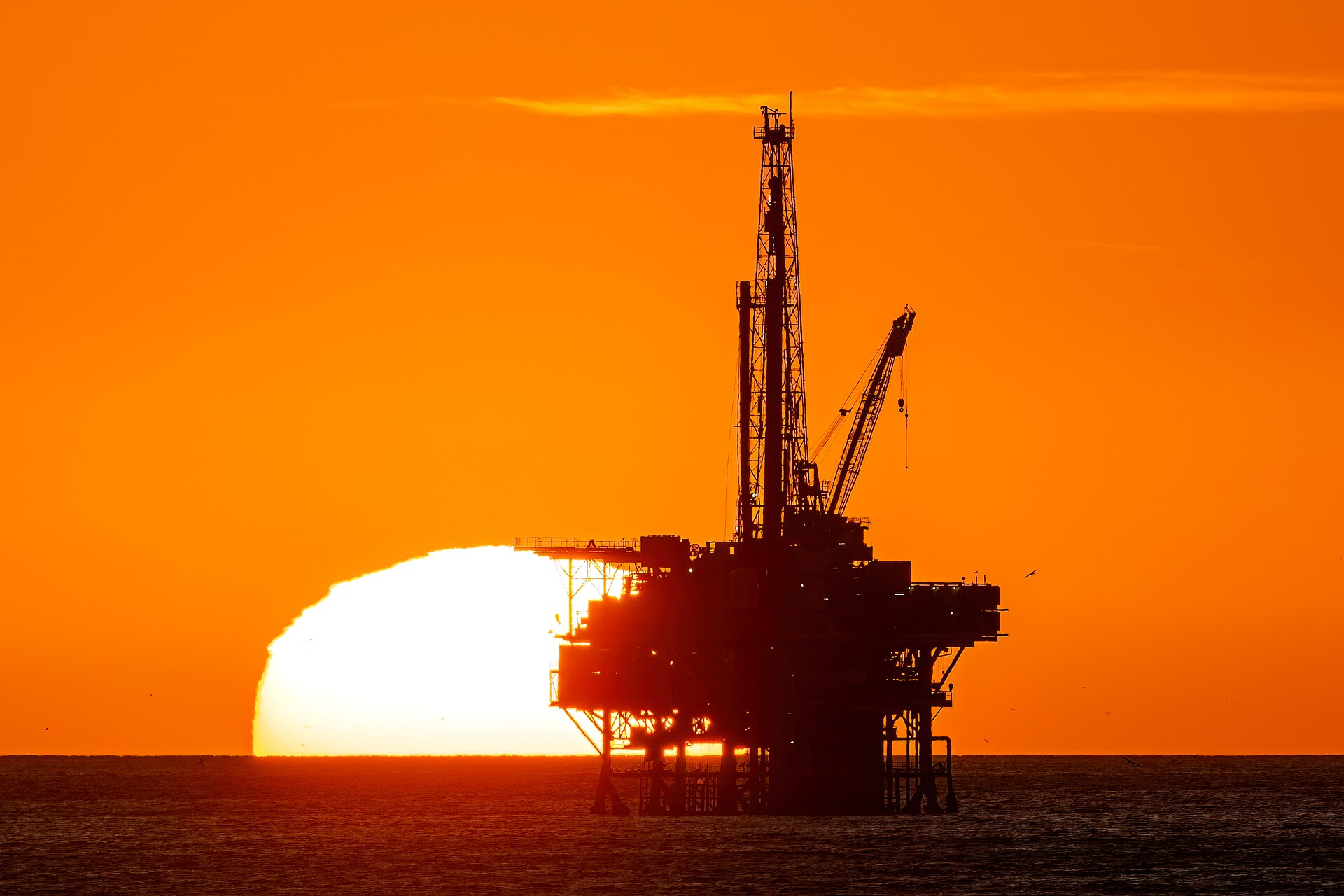 Offshore oil Platform Holly silhouetted at sunset off Isla Vista