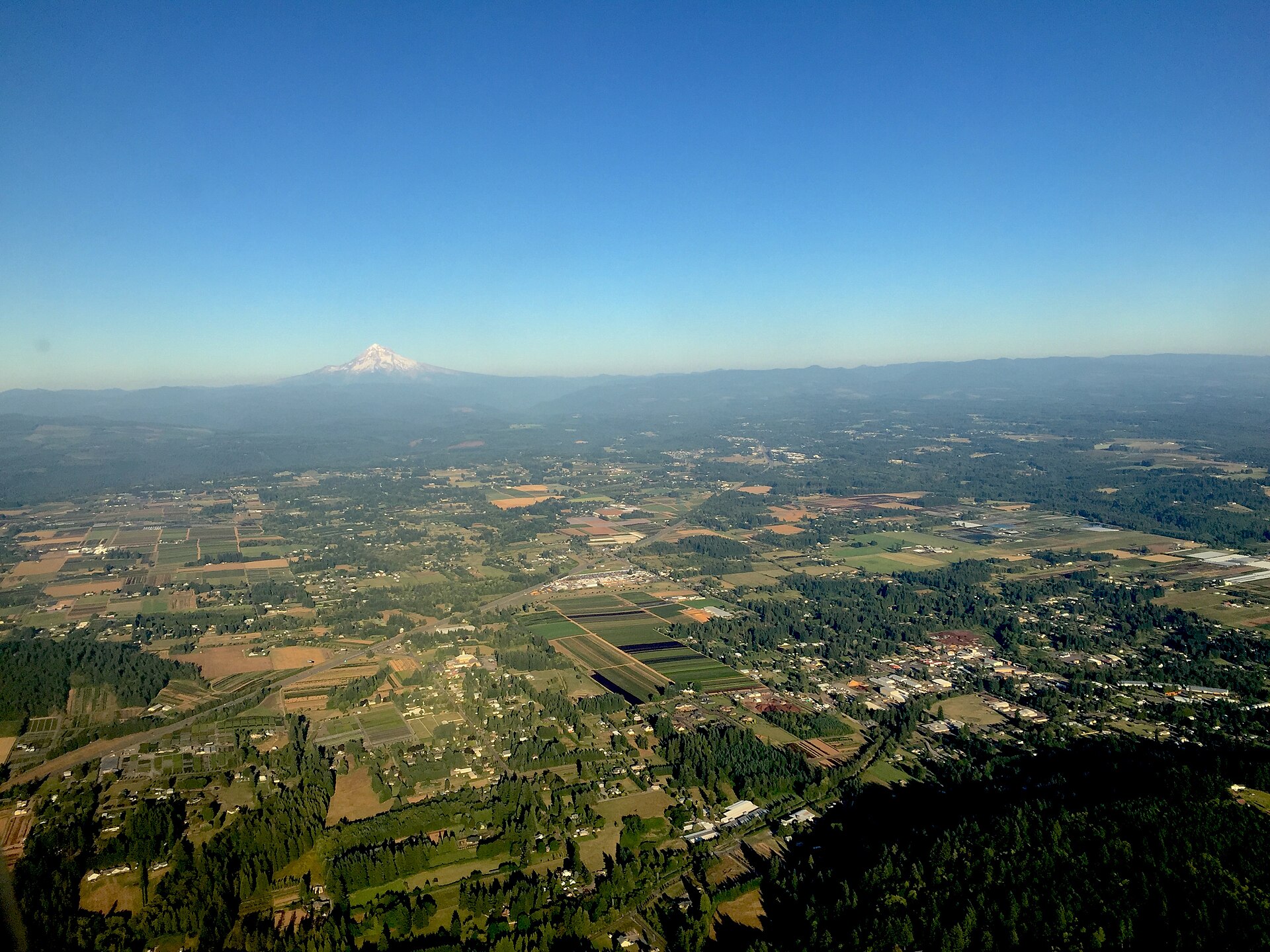 Aerial view of Boring and Damascus with farmland and forested hills