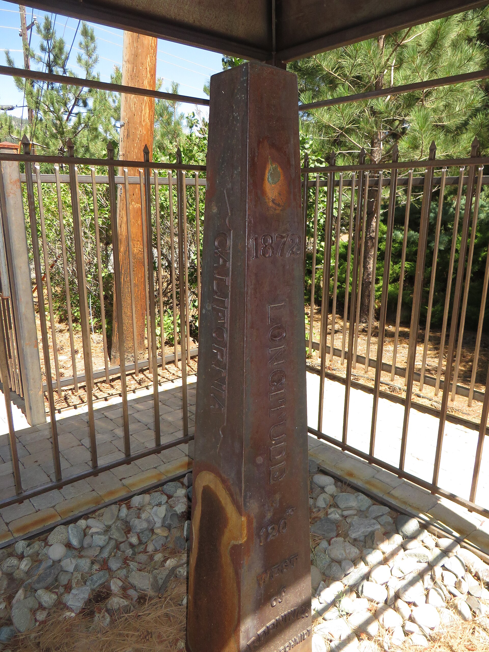 The rusted iron 1872 California-Nevada state line boundary marker on display in Verdi, Nevada