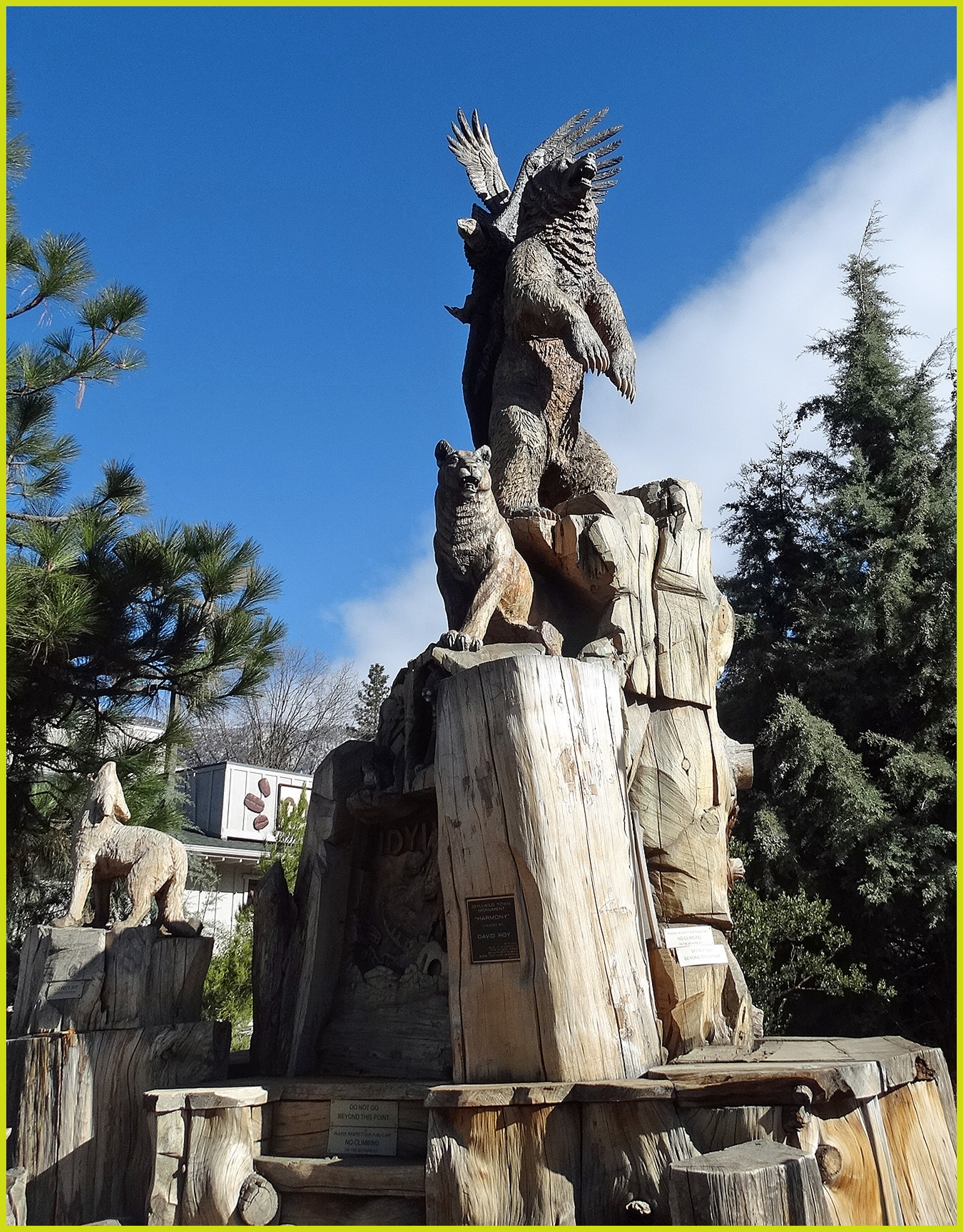 A tall carved-wood sculpture of a bear, eagle, and other animals in Idyllwild, California.