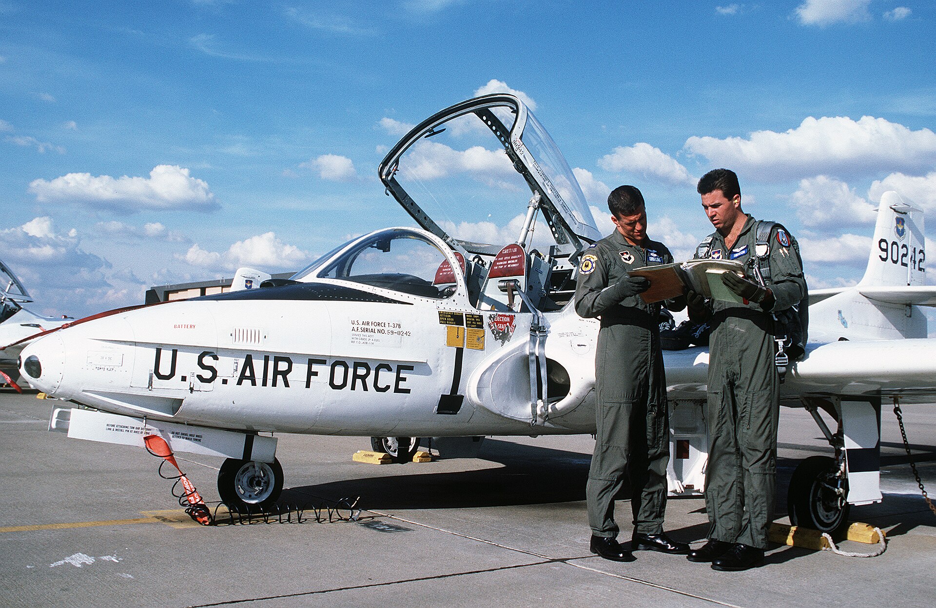 A U.S. Air Force jet with crew members at Mather Air Force Base California.