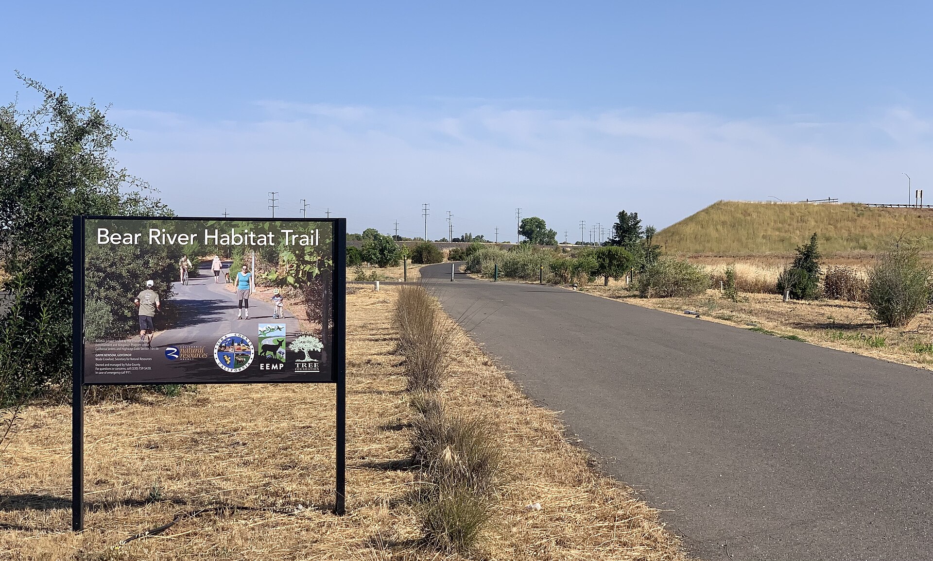 A paved trail at the Bear River Habitat Trail trailhead in Plumas Lake, California.