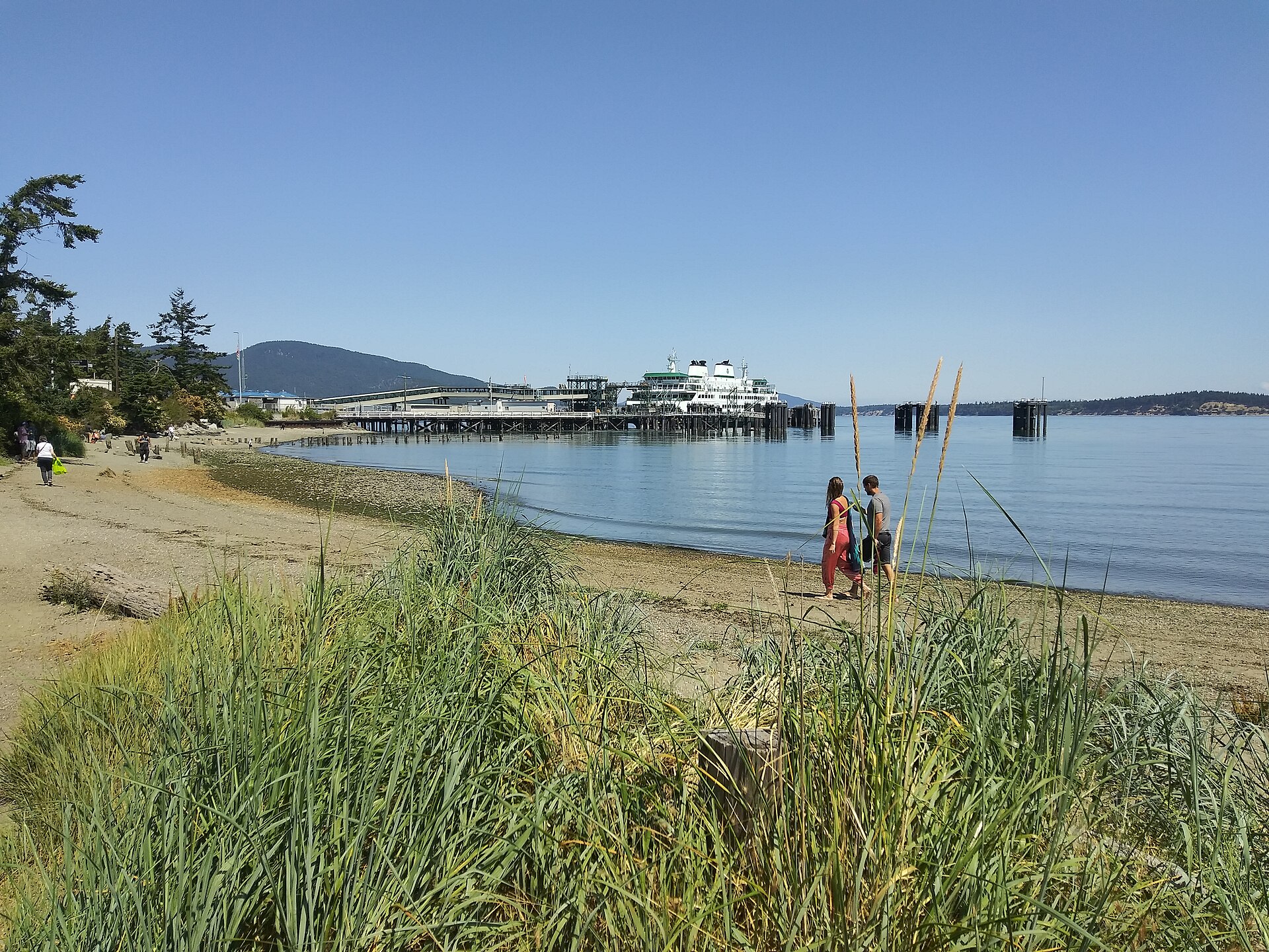 The beach in Anacortes, Washington, with the ferry terminal across the water