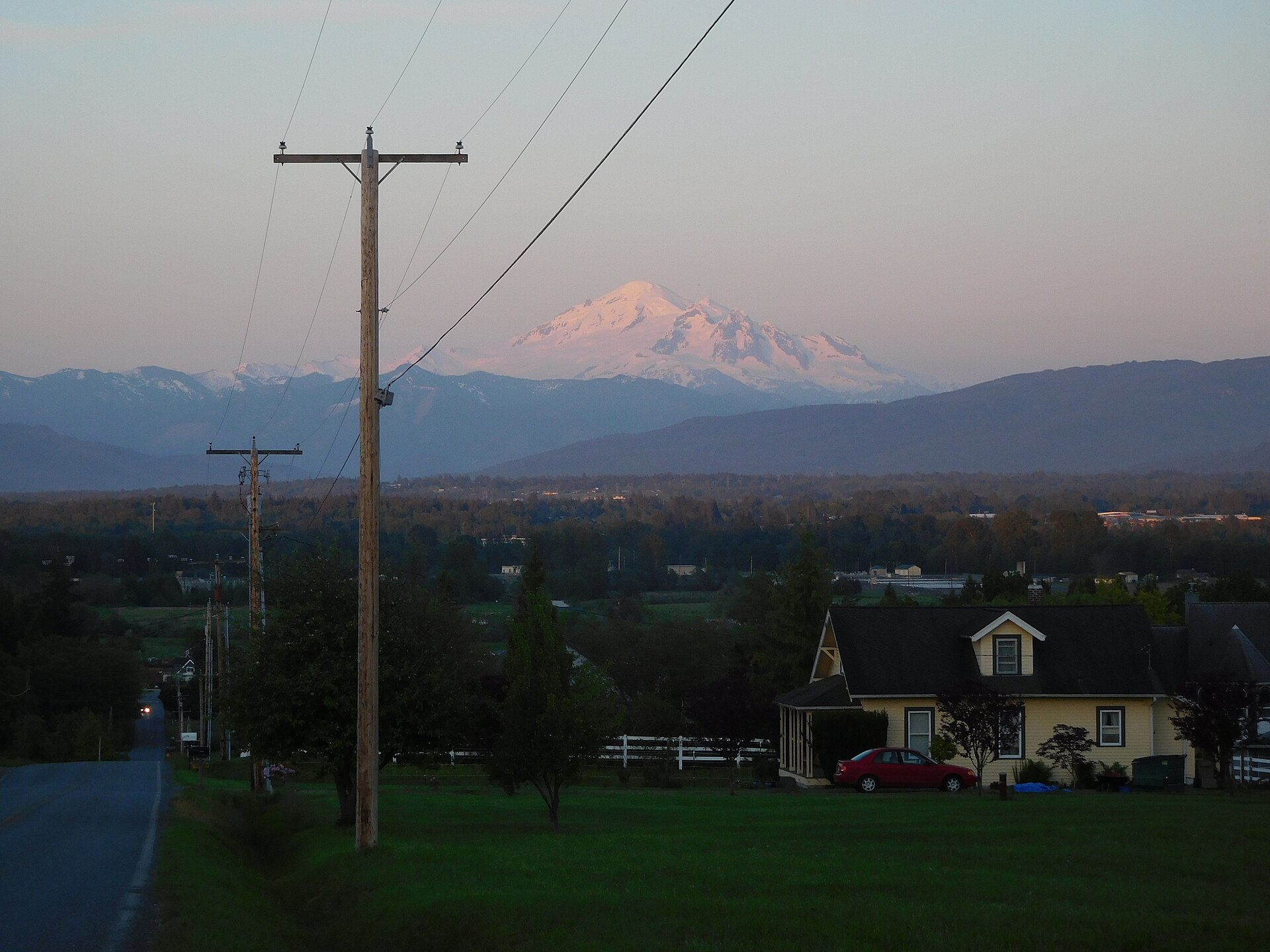 Mount Baker glowing at dusk over Ferndale, Washington