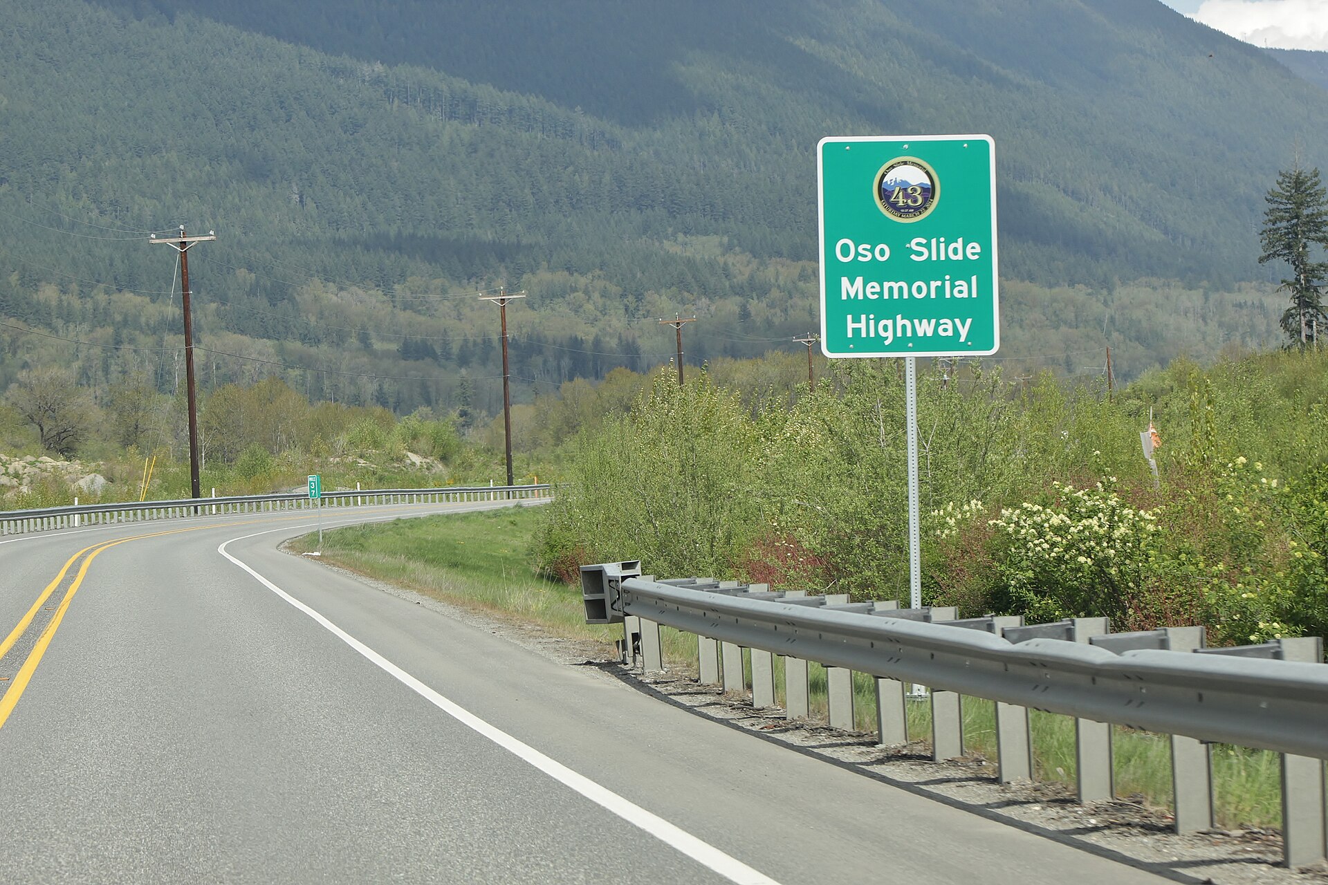 A highway sign designating State Route 530 as the Oso Slide Memorial Highway near Oso, Washington.
