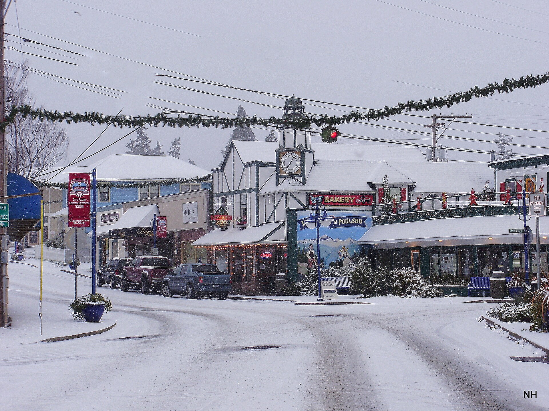 A snowy street with Scandinavian-style shops in downtown Poulsbo Washington.