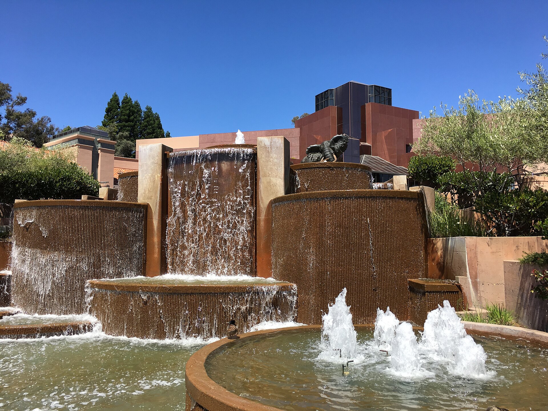 Tiered waterfalls flowing over stone at Blackhawk Plaza.