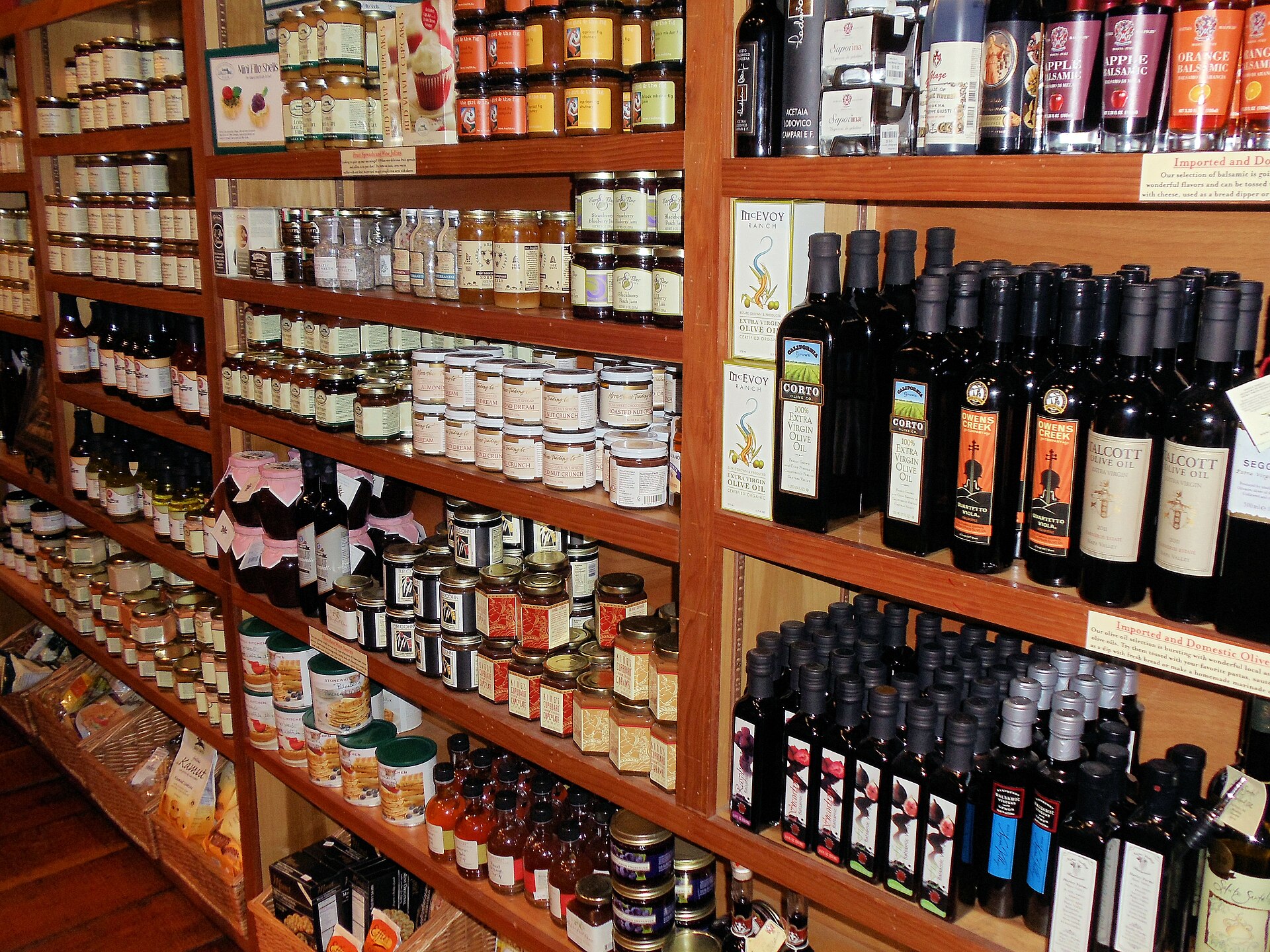 Shelves of wine bottles and gourmet foods inside the V. Sattui Winery marketplace in St. Helena.