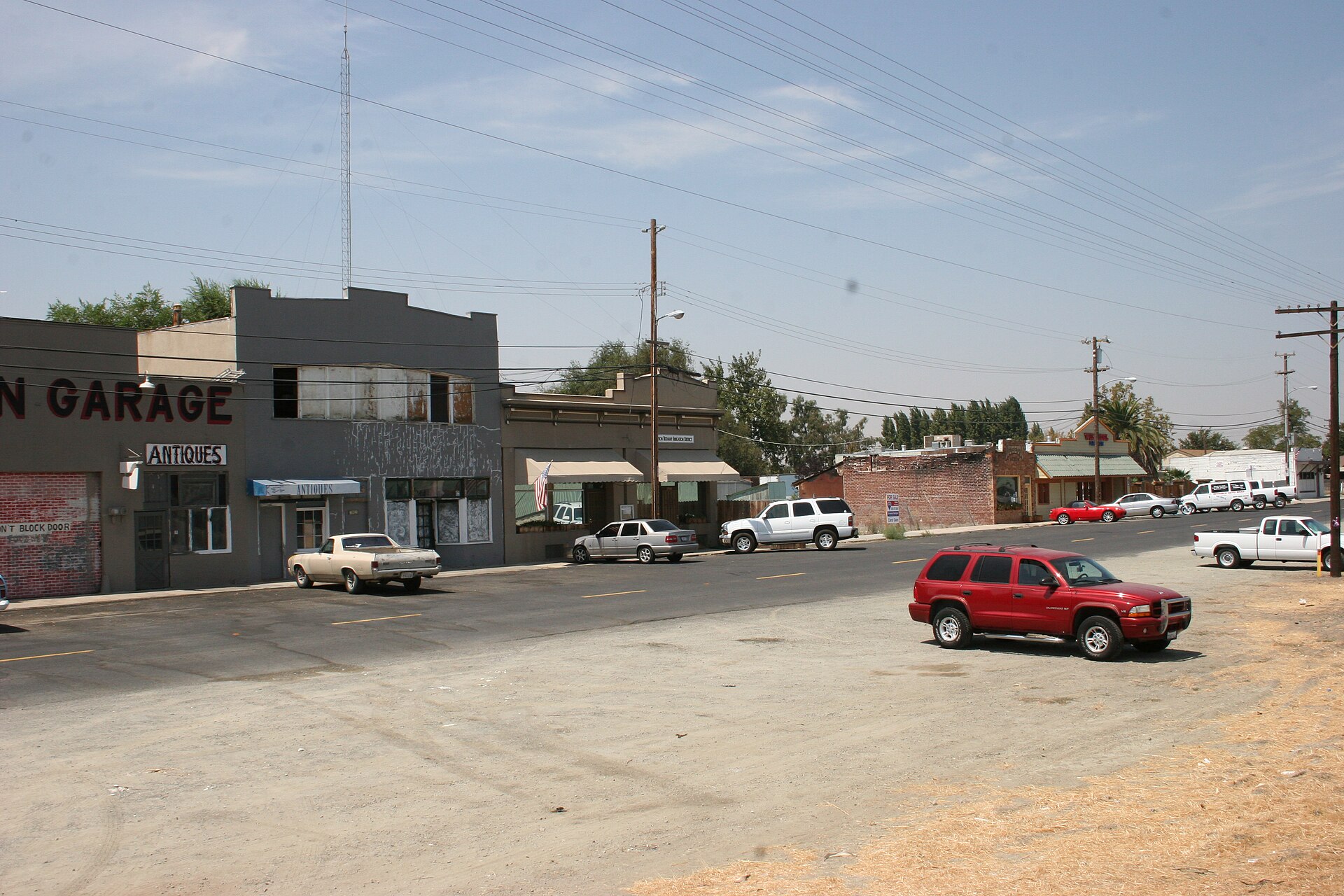 Storefronts and parked cars along Main Street in Byron, California