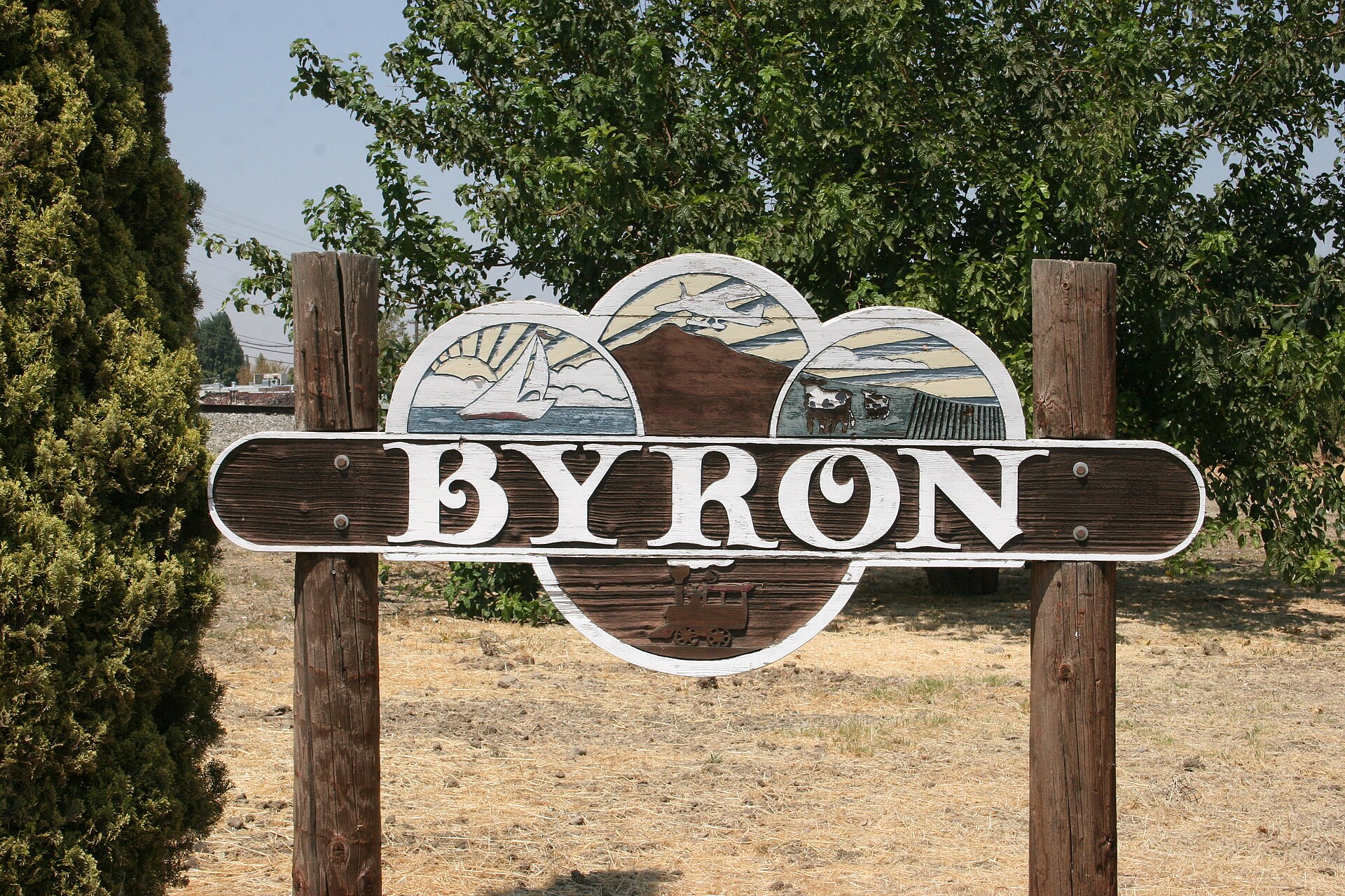 A carved wooden sign welcoming visitors to Byron, California