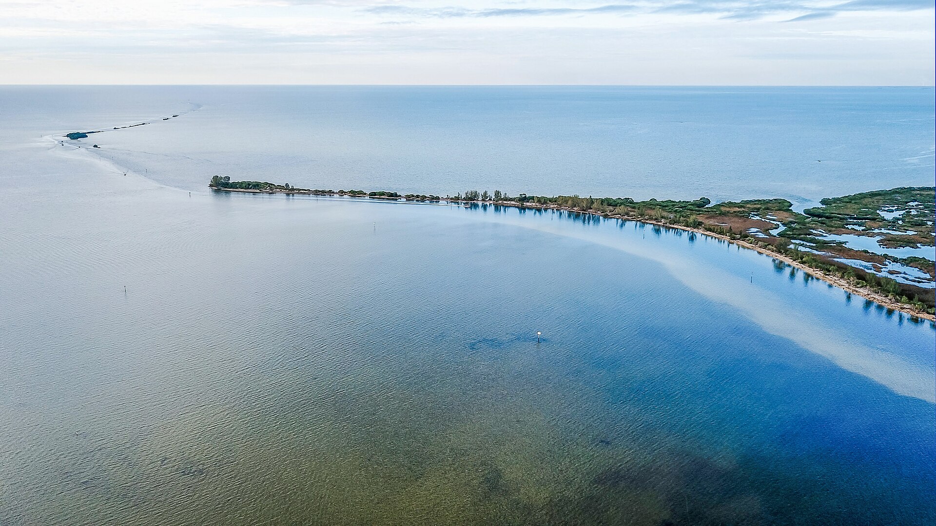 Aerial view of the shallow coastal flats and barrier island off Hernando Beach, Florida