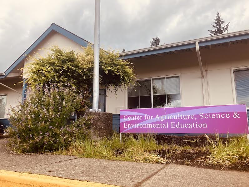 A low building with a sign for the CASEE Center in Brush Prairie, Washington.