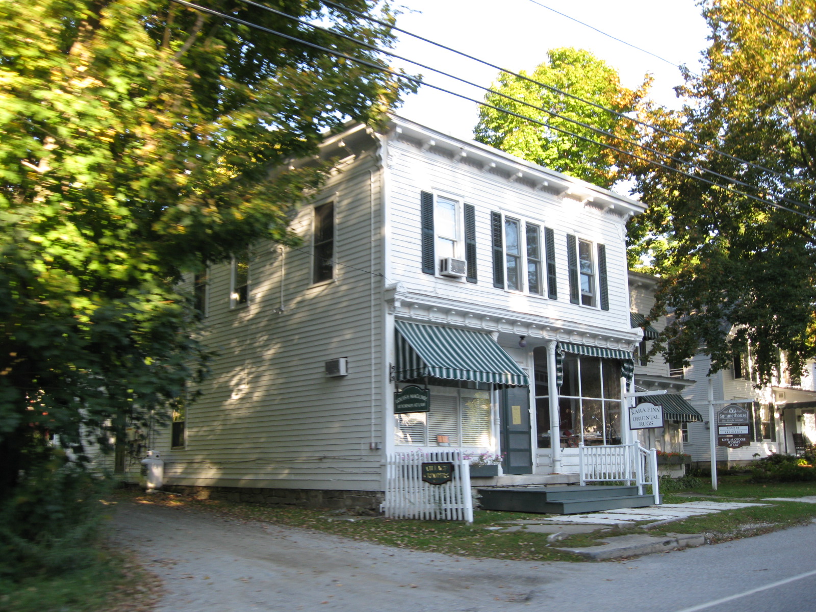 A clapboard store with striped awnings in Dorset Village, Vermont
