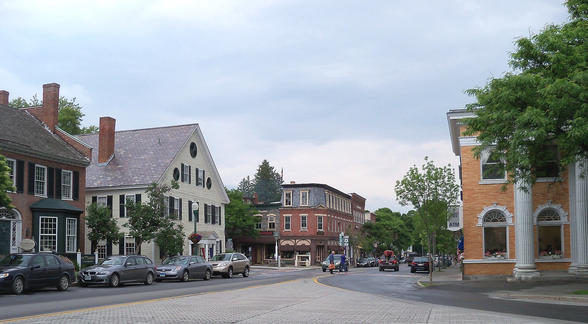 A street with historic brick buildings in Woodstock Vermont.
