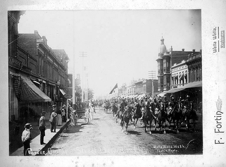 Historic photograph of a parade on Main Street in Walla Walla in 1892