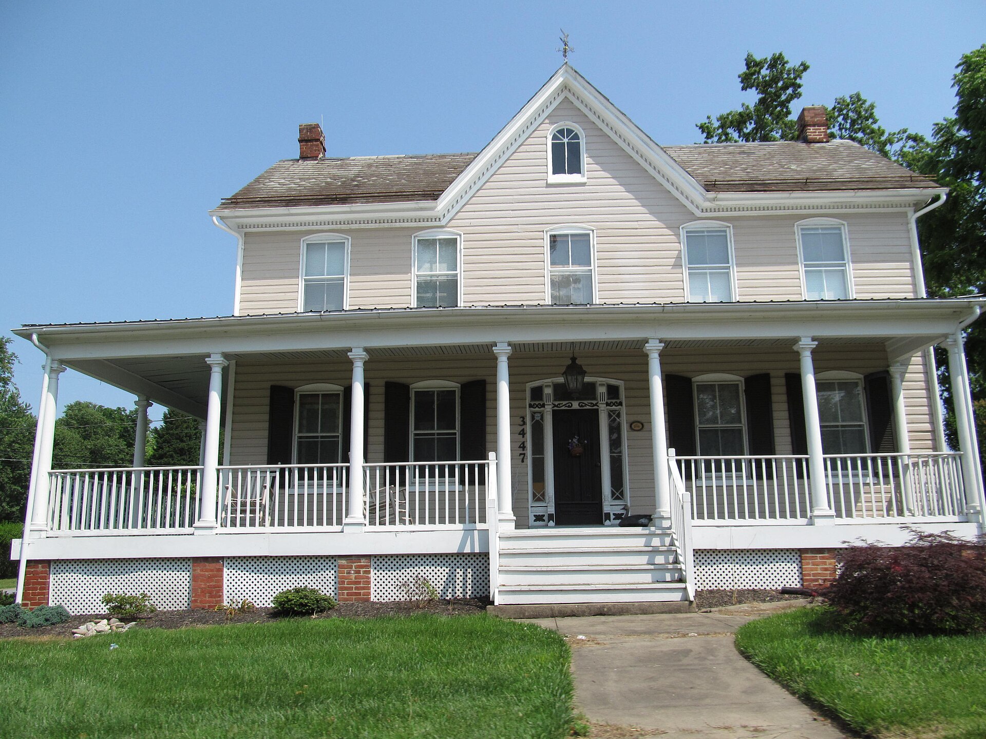 Historic white house with a wide porch in Buckeystown