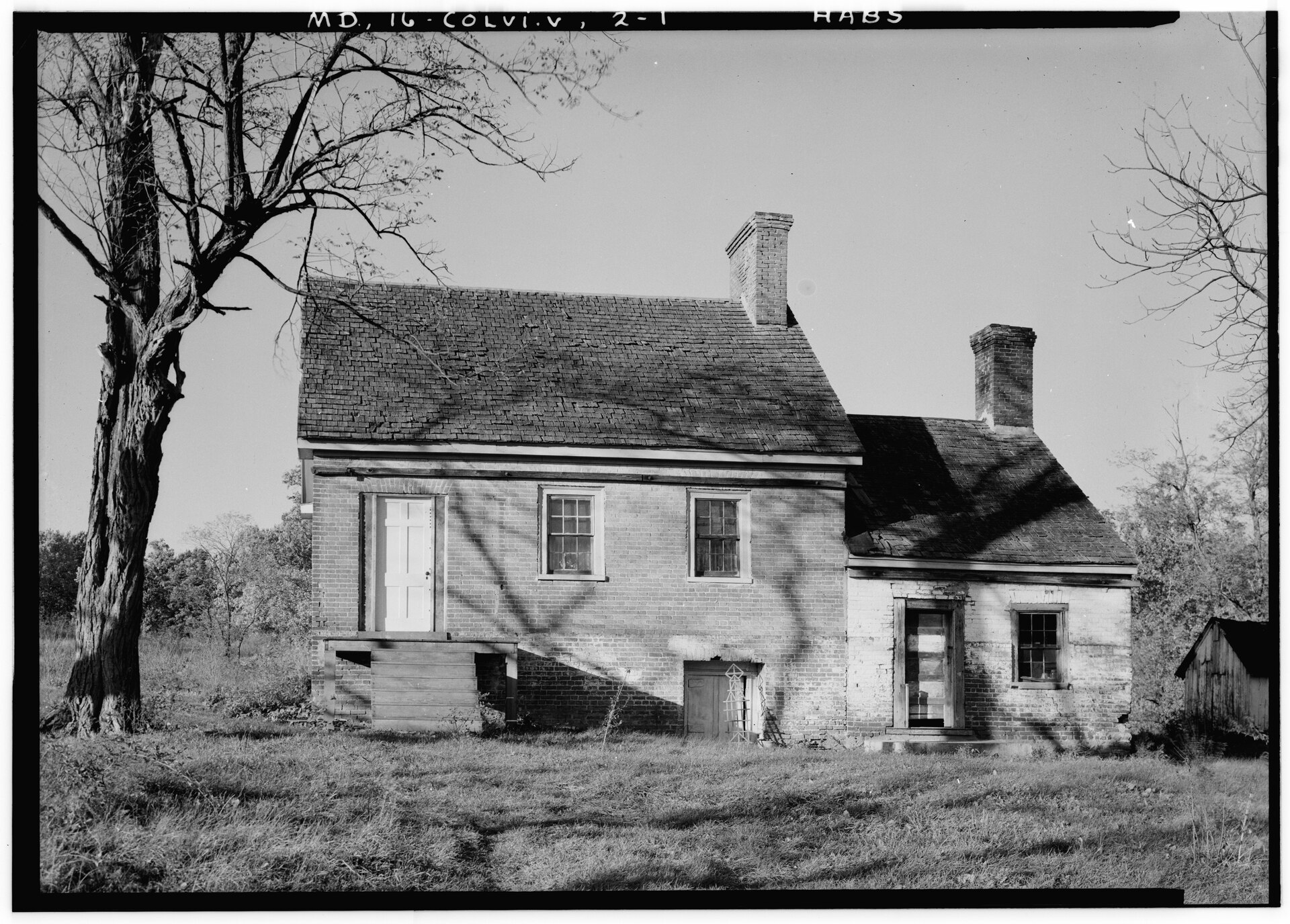 Black-and-white 1936 photo of a small brick house.